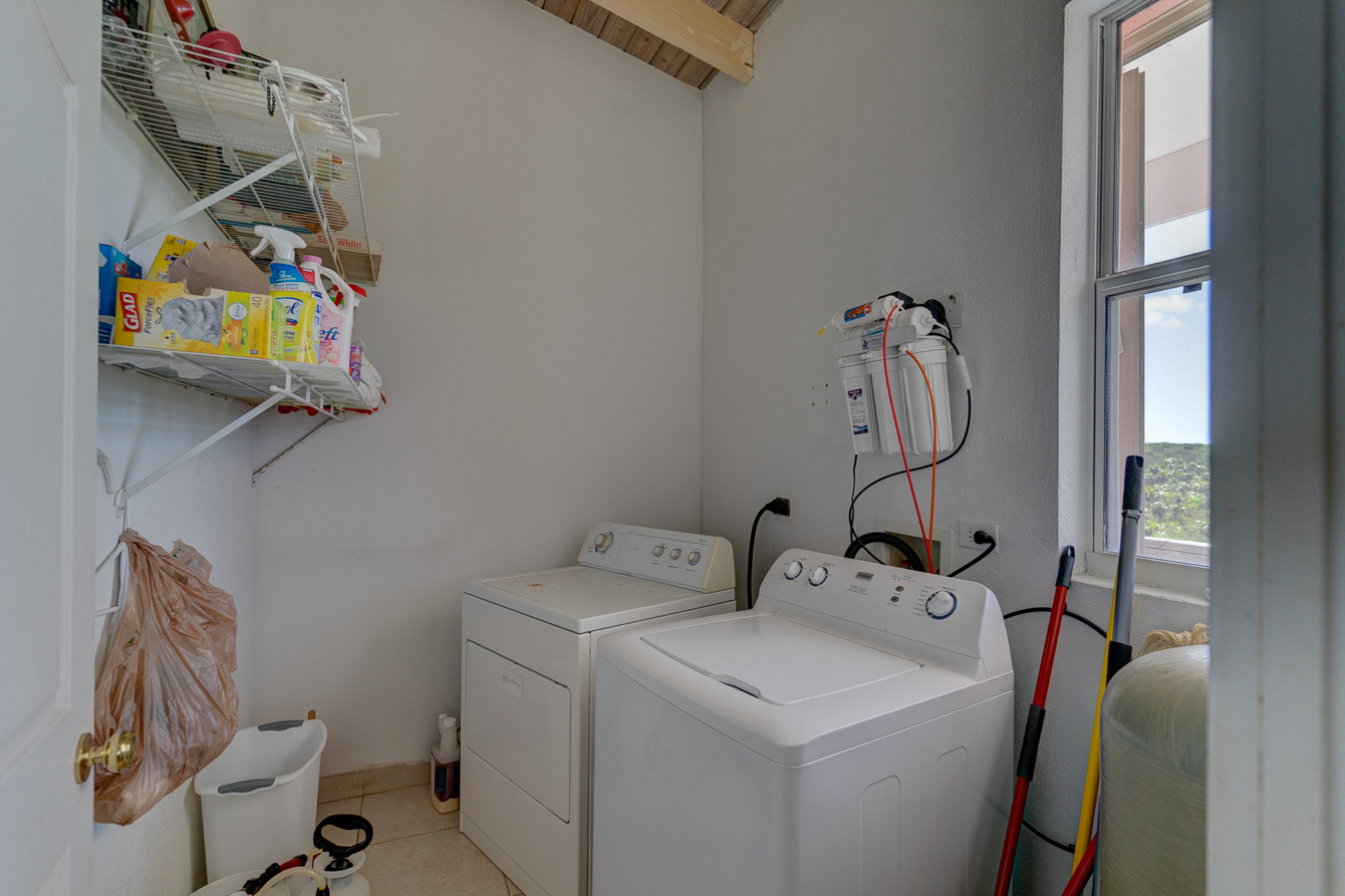 The Laundry room next to the kitchen at The Family Beach House on San Salvador