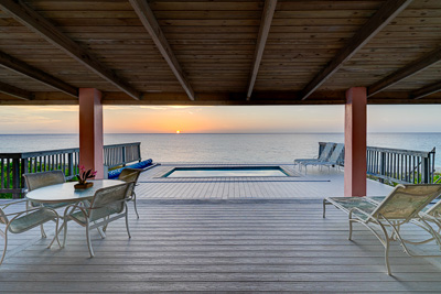 The pool at sunset at The Family Beach House on San Salvador 