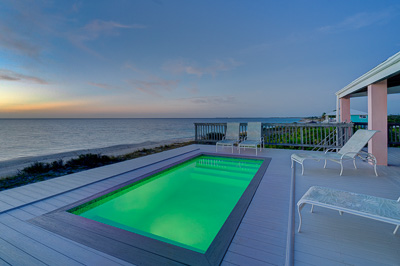 The pool at sunset at The Family Beach House on San Salvador 